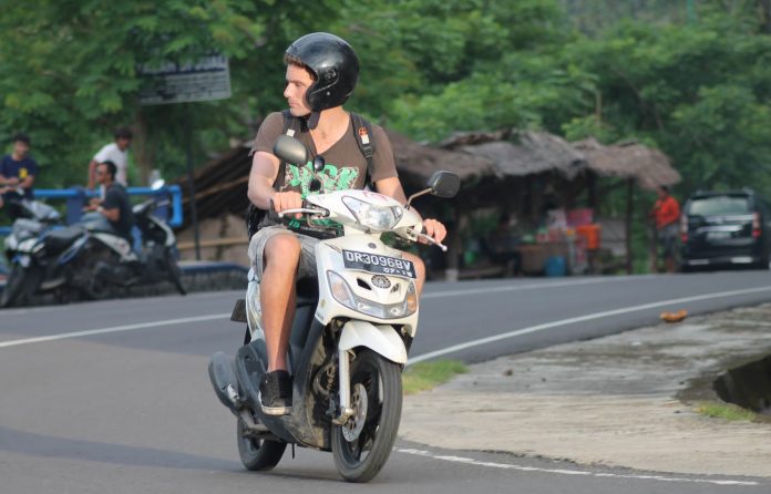 asing memiliki sepeda motor