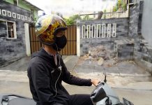 Mendengarkan Musik Sambil Berkendara, Begini Aturannya mendengarkan musik